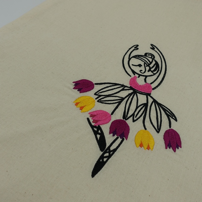 tote bag brodé danseuse robe avec des tulipes roses et jaunes vives en gros plan